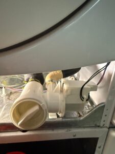 Dishwasher drain pump repair close-up