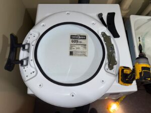 Washer door assembly removed for repair